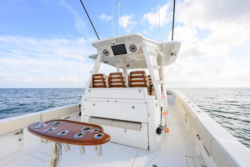  Yacht Photos Pics 2022 SeaVee 450Z boat deck with seating, ocean view, and clear sky.