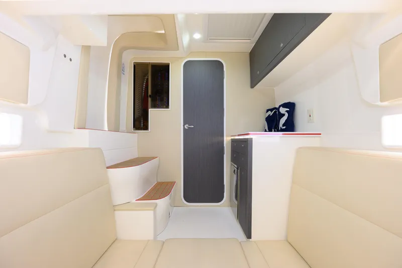  Yacht Photos Pics Interior of 2022 SeaVee 450Z boat, featuring modern seating and cabinetry.