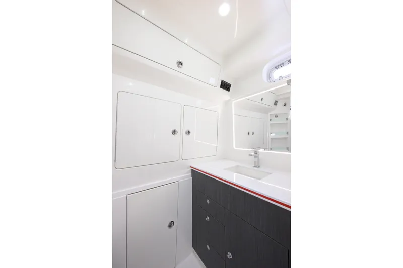  Yacht Photos Pics 2022 SeaVee 450Z boat interior bathroom with modern cabinetry and sleek design.