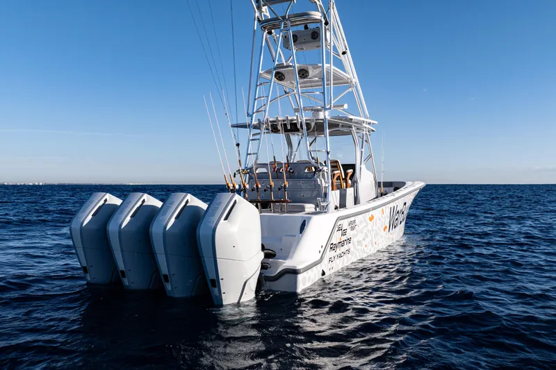  Yacht Photos Pics 2026 SeaVee 420Z boat with four engines on open water, clear blue sky.
