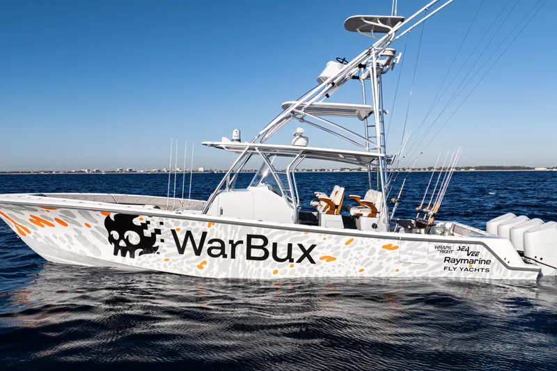  Yacht Photos Pics 2026 SeaVee 420Z boat on water, featuring "WarBux" design and fishing equipment.