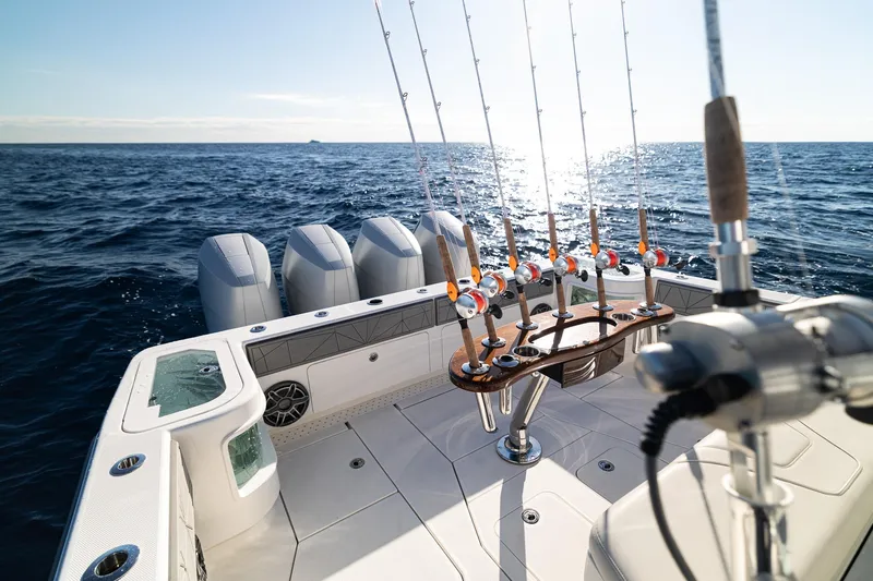  Yacht Photos Pics 2026 SeaVee 420Z fishing boat with multiple rods, ocean view, and powerful engines.