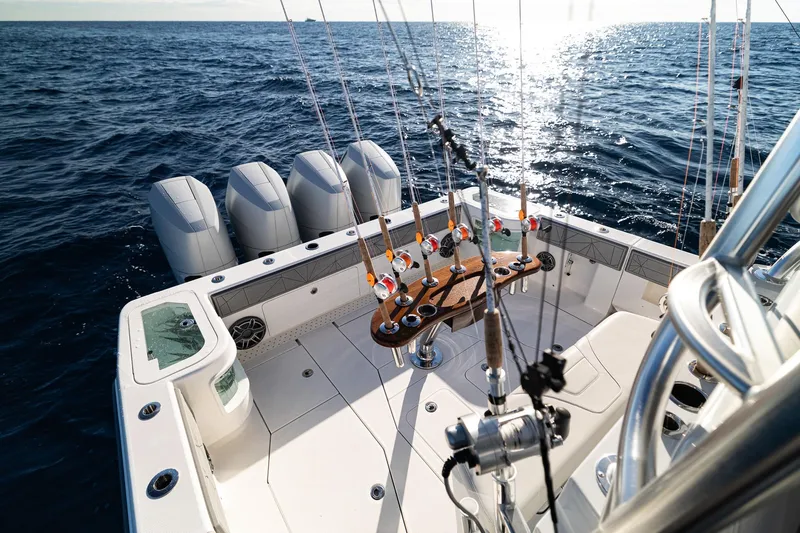  Yacht Photos Pics 2026 SeaVee 420Z fishing boat with multiple rods, ocean view, and powerful engines.