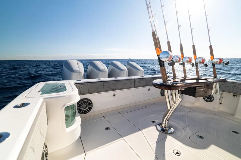  Yacht Photos Pics 2026 SeaVee 420Z fishing boat with rods and powerful engines on open sea.