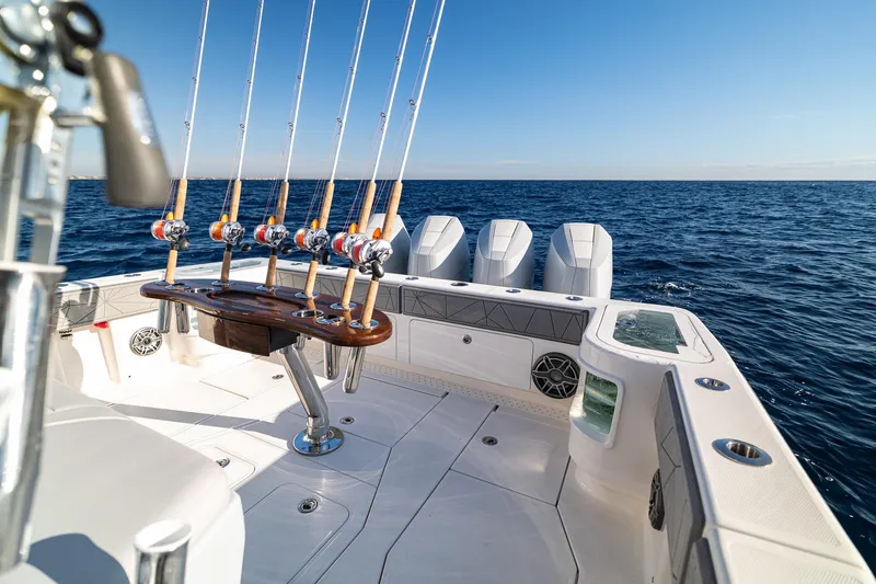  Yacht Photos Pics 2026 SeaVee 420Z fishing boat with rods, ocean view, and clear sky.