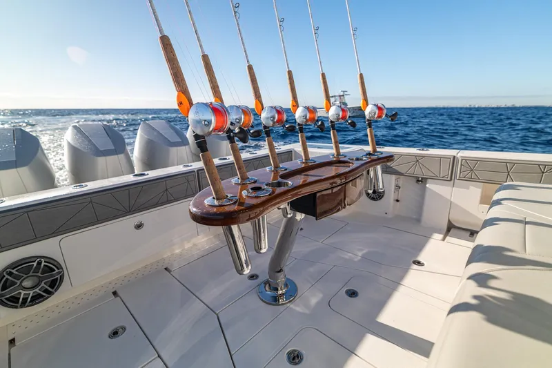  Yacht Photos Pics 2026 SeaVee 420Z fishing boat with multiple rods, ocean backdrop, and sleek design.