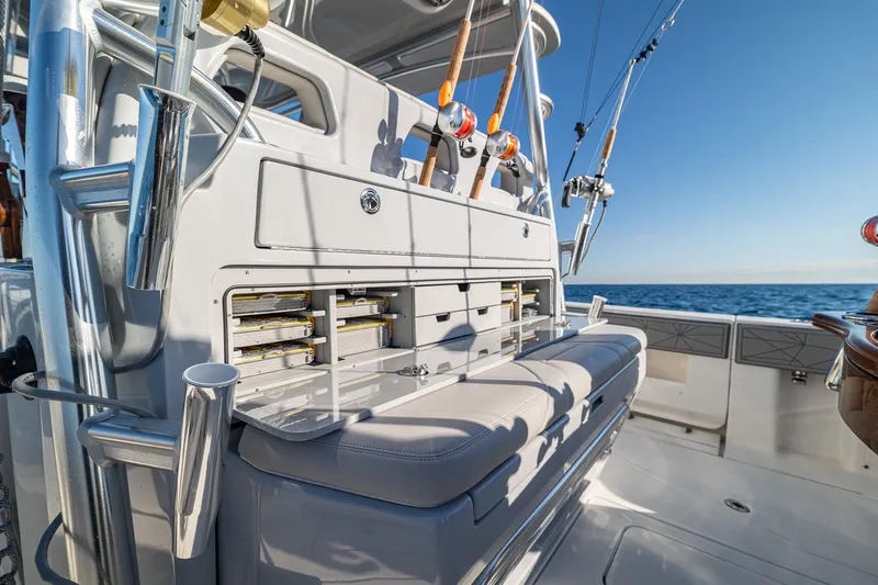  Yacht Photos Pics 2026 SeaVee 420Z fishing boat with rod holders and tackle storage, ocean backdrop.