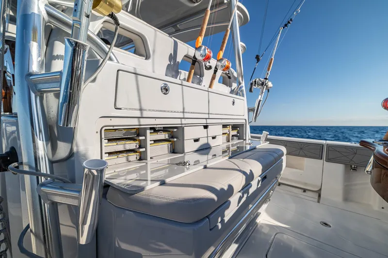  Yacht Photos Pics 2026 SeaVee 420Z fishing boat with rod holders and tackle storage, ocean backdrop.