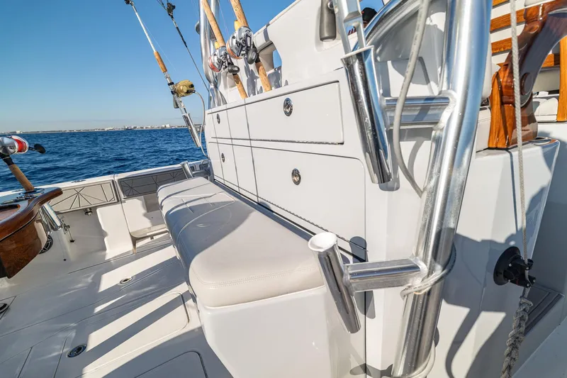  Yacht Photos Pics 2026 SeaVee 420Z boat interior with fishing rods and seating on open water.