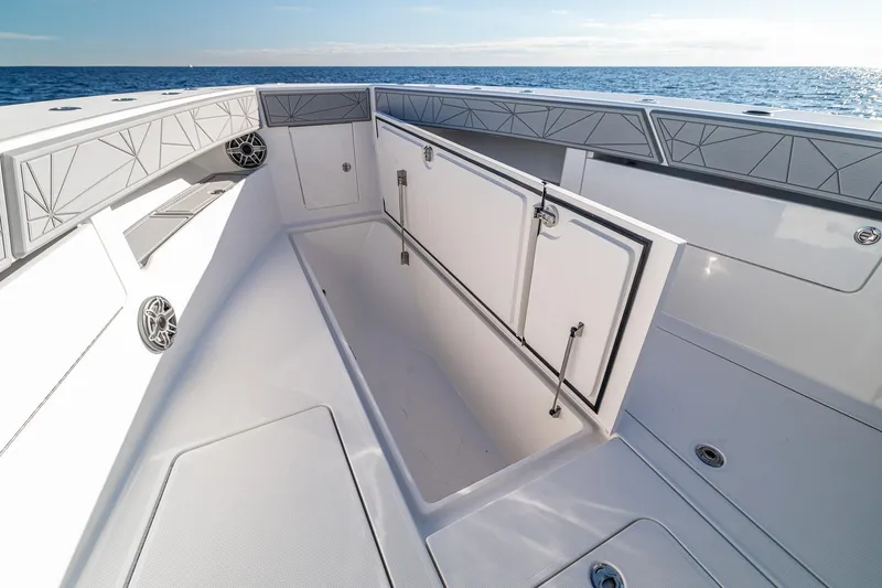  Yacht Photos Pics 2026 SeaVee 420Z boat interior with open storage compartment, ocean view in background.