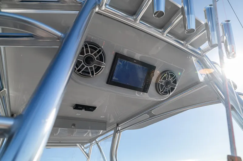  Yacht Photos Pics 2026 SeaVee 420Z boat console with speakers and display screen, under bright sunlight.