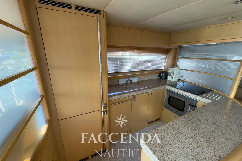  Yacht Photos Pics Luxurious kitchen interior of 2008 Princess 67 Flybridge yacht with modern appliances.