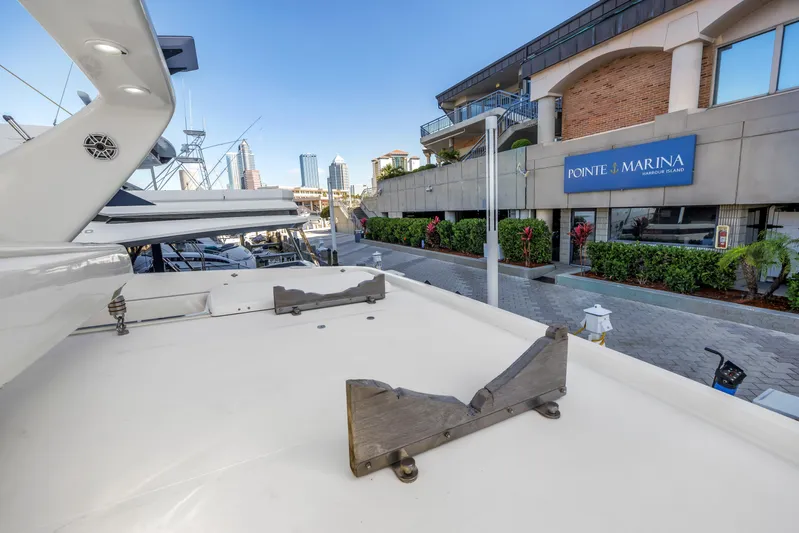 Solaris Yacht Photos Pics 2009 Uniesse 65 MY yacht docked at Ponte Marina, urban backdrop.