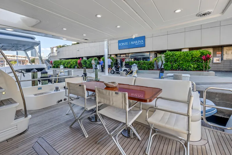 Solaris Yacht Photos Pics Luxury Uniesse 65 MY yacht deck with seating, docked at Ponte Marina, 2009 model.