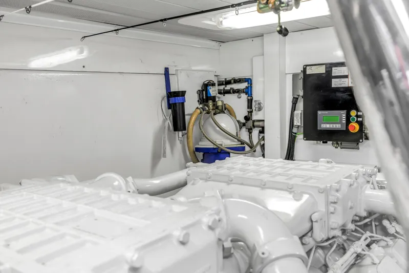 Solaris Yacht Photos Pics Engine room of 2009 Uniesse 65 MY yacht, featuring dual engines and control systems.
