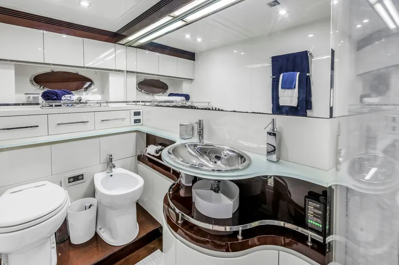 Solaris Yacht Photos Pics Luxurious bathroom in 2009 Uniesse 65 MY yacht with modern fixtures and elegant design.