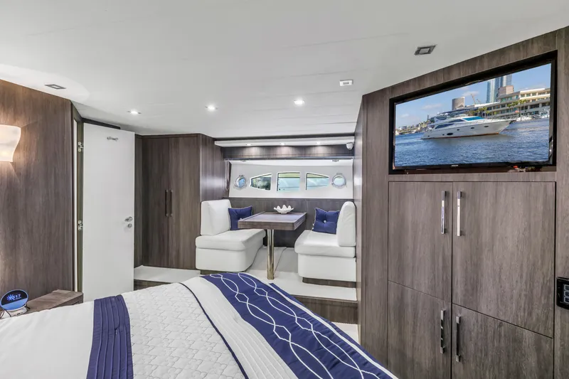 Solaris Yacht Photos Pics Luxurious interior of 2009 Uniesse 65 MY yacht with modern furnishings and a mounted TV.