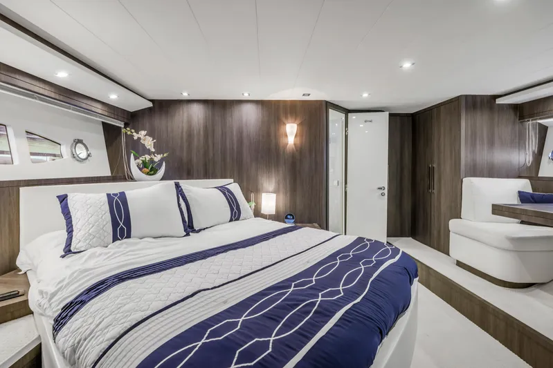 Solaris Yacht Photos Pics Luxurious bedroom interior of 2009 Uniesse 65 MY yacht with modern design and elegant decor.