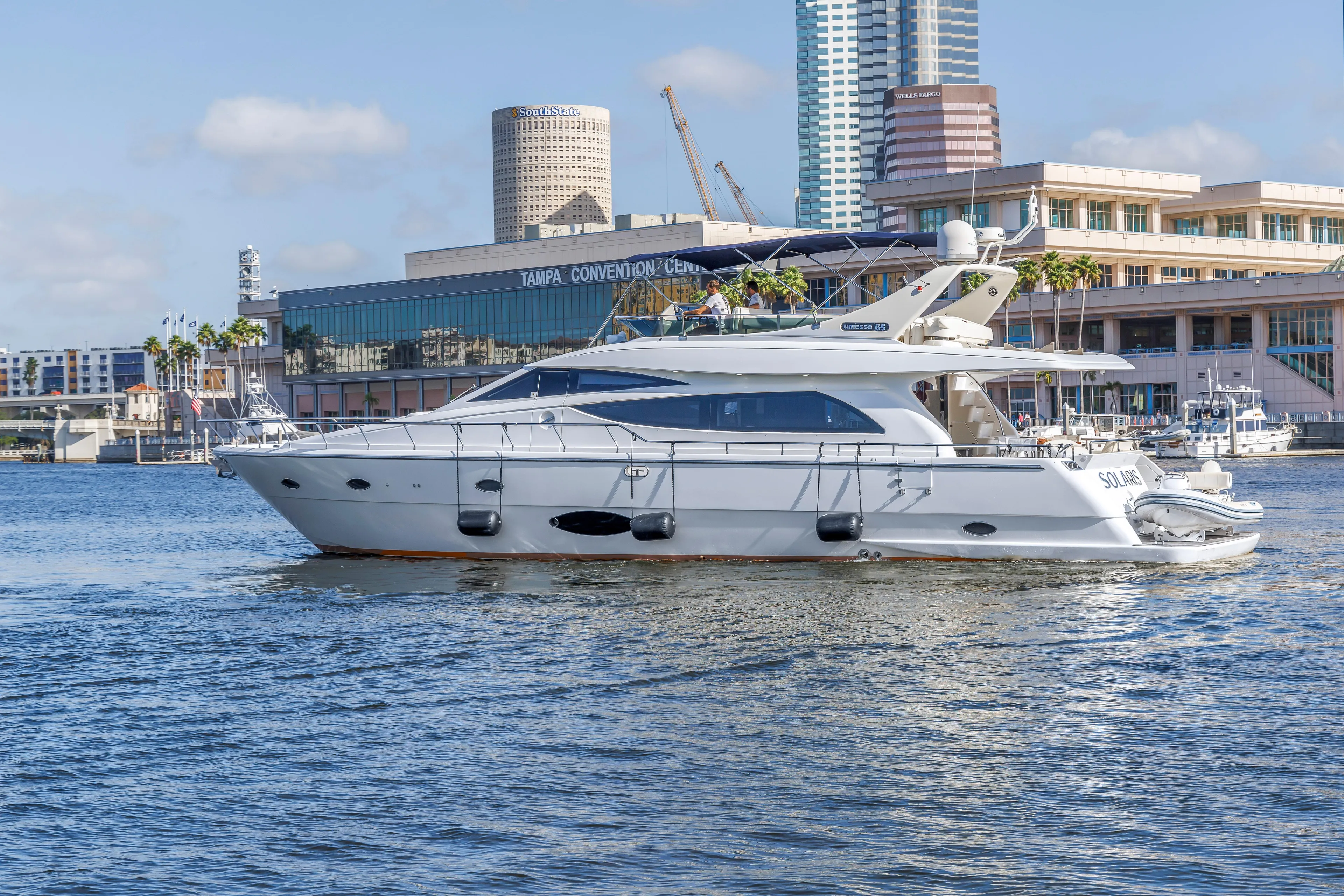 Solaris Yacht Photos Pics 2009 Uniesse 65 MY yacht cruising near Tampa Convention Center.