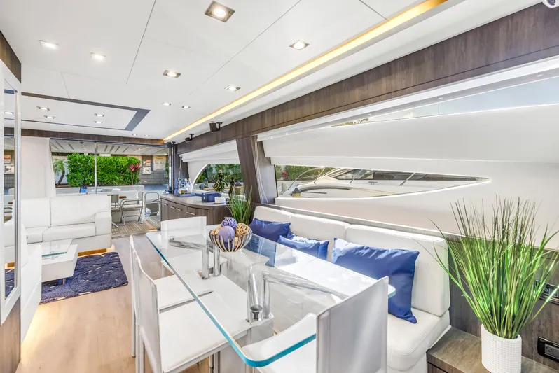 Solaris Yacht Photos Pics Luxurious interior of 2009 Uniesse 65 MY yacht with modern decor and elegant seating.