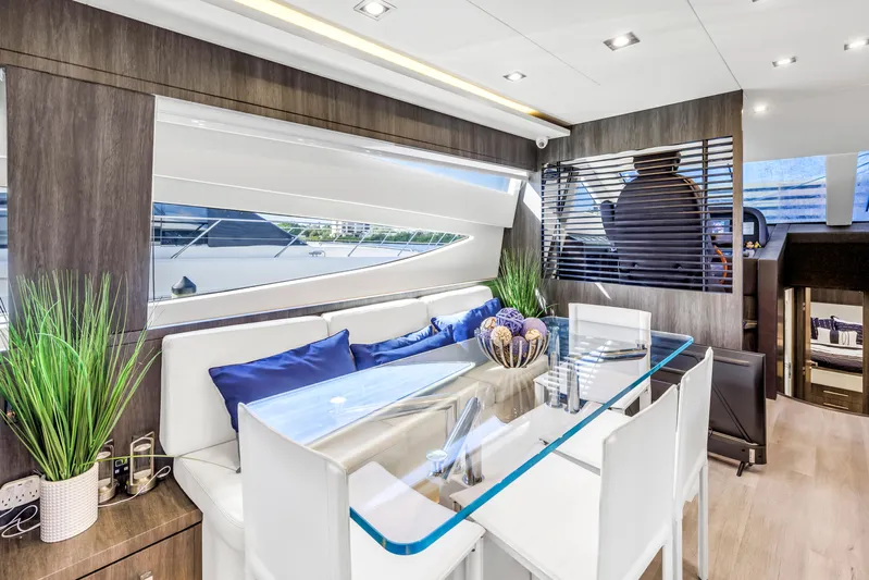 Solaris Yacht Photos Pics Luxurious interior of 2009 Uniesse 65 MY yacht with modern dining area.