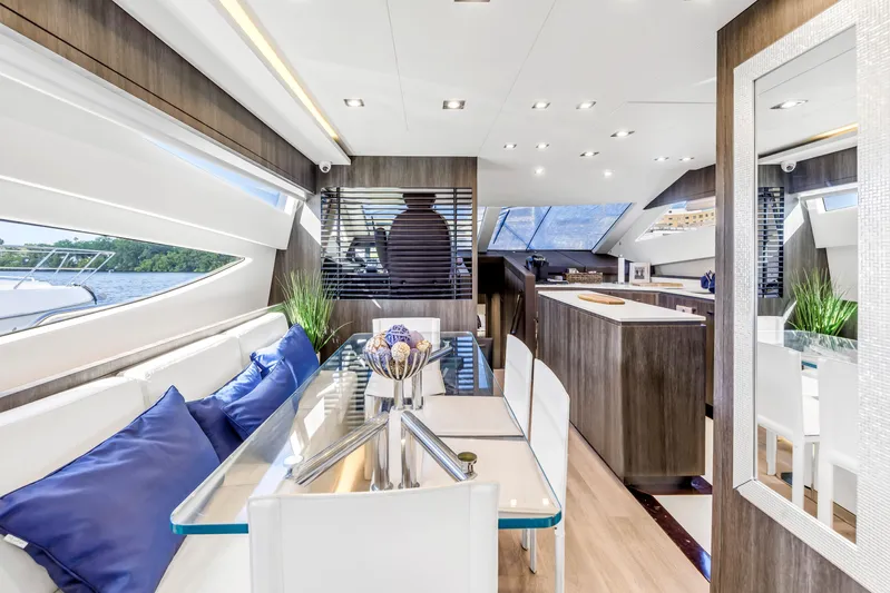 Solaris Yacht Photos Pics Luxurious interior of 2009 Uniesse 65 MY yacht with modern dining area and sleek design.