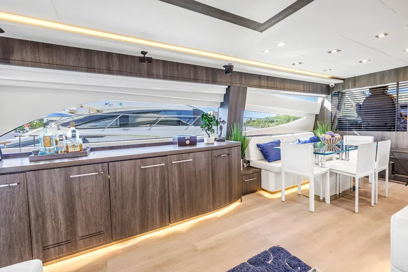 Solaris Yacht Photos Pics Luxurious interior of 2009 Uniesse 65 MY yacht with modern dining area and elegant decor.