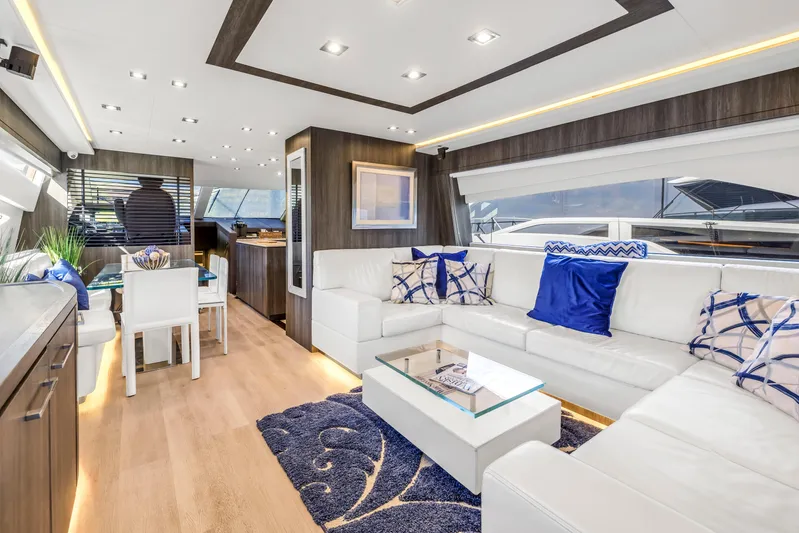 Solaris Yacht Photos Pics Luxurious interior of 2009 Uniesse 65 MY yacht with modern decor and white seating.