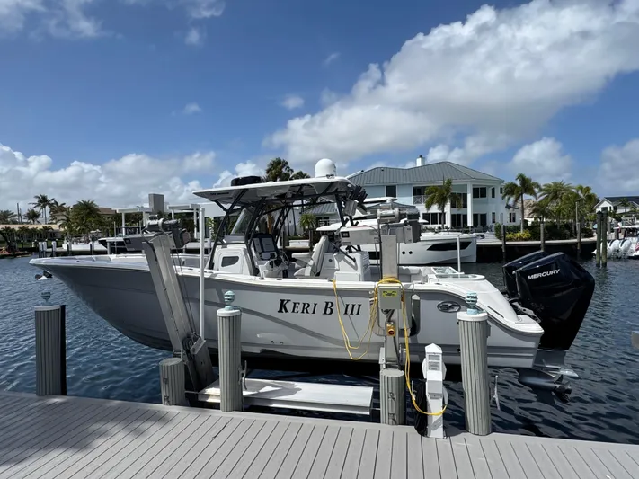 Keri B III Yacht Photos Pics 2023 Sea Fox 328 Commander boat docked at marina under blue sky.