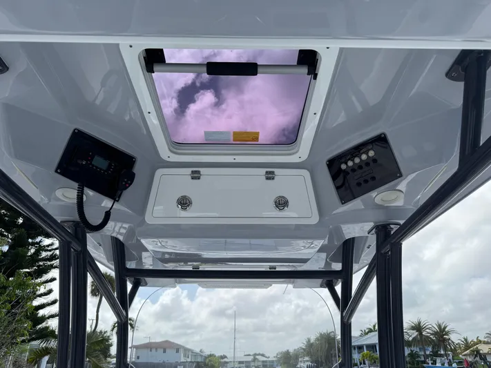 Keri B III Yacht Photos Pics 2023 Sea Fox 328 Commander boat interior with control panels and skylight.