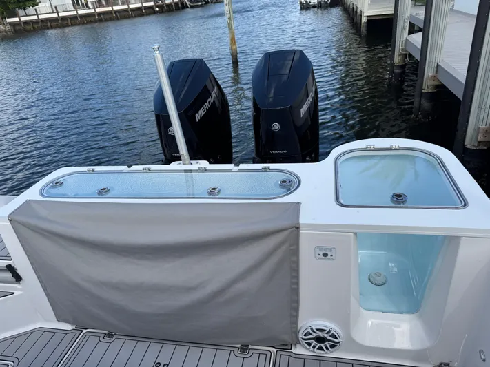 Keri B III Yacht Photos Pics 2023 Sea Fox 328 Commander boat with dual Mercury engines docked by the water.