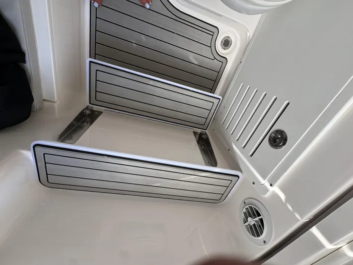 Keri B III Yacht Photos Pics 2023 Sea Fox 328 Commander interior with foldable seating and modern design features.