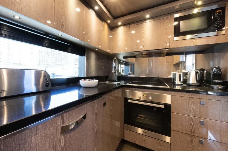  Yacht Photos Pics Luxurious kitchen interior on 2013 Sunseeker 28 Metre Yacht with modern appliances and sleek design.
