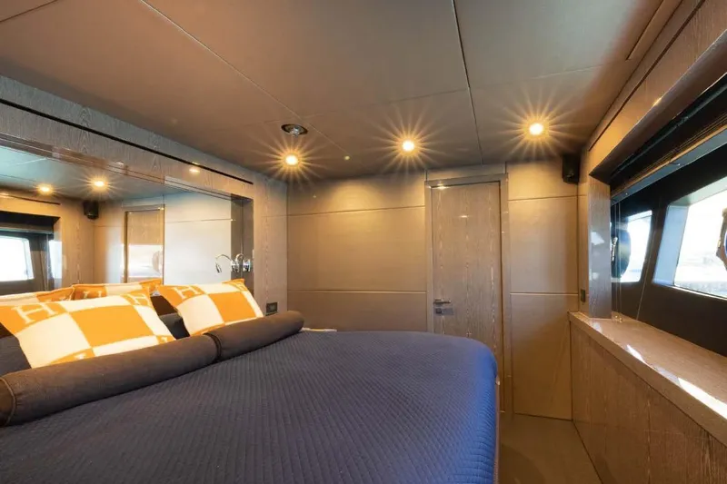  Yacht Photos Pics Luxurious bedroom interior of 2013 Sunseeker 28 Metre Yacht with modern lighting and decor.