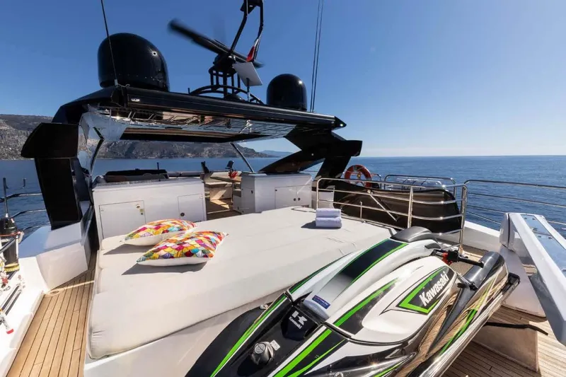 Yacht Photos Pics Luxurious 2013 Sunseeker 28 Metre Yacht with sun deck and jet ski, cruising on open sea.