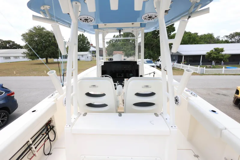 Yacht Photos Pics 2022 Cobia 301 Center Console boat interior with dual seats and steering console.