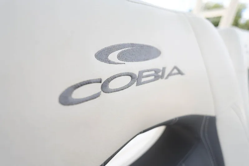  Yacht Photos Pics 2022 Cobia 301 Center Console logo on boat seat upholstery.