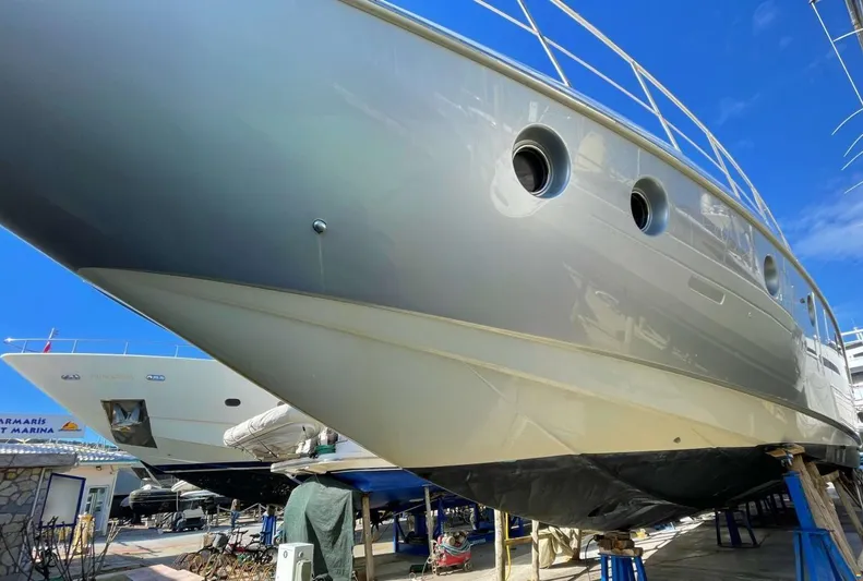  Yacht Photos Pics 2006 Azimut 86S yacht in dry dock, showcasing sleek hull design and portholes.