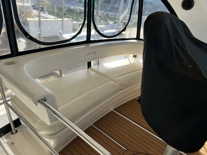 Moderation Yacht Photos Pics 2001 Sea Ray 56 Sedan Bridge interior seating area with panoramic windows.