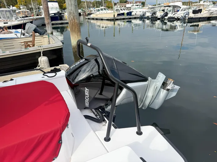 Underestimated Yacht Photos Pics Axopar 28 CABIN 2021 with Mercury outboard engine at marina dock.