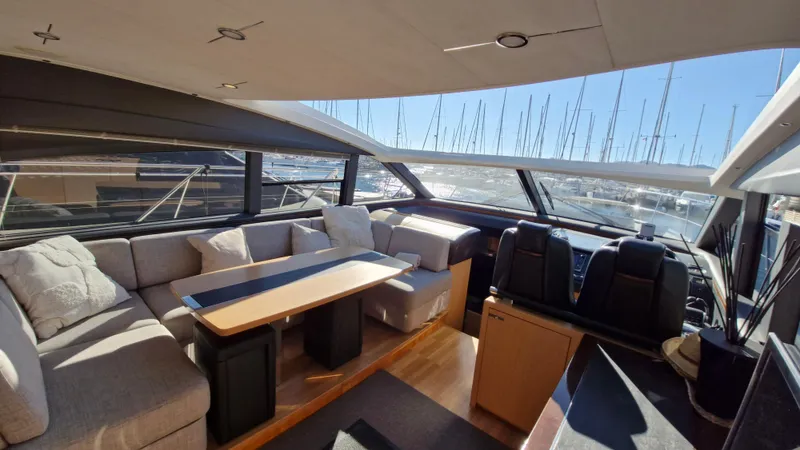  Yacht Photos Pics Luxurious interior of 2012 Princess V57 yacht with spacious seating and panoramic windows.