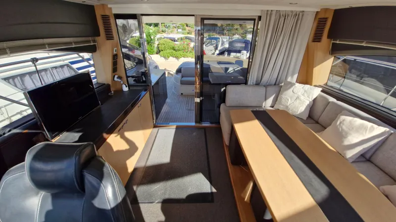  Yacht Photos Pics Luxurious interior of 2012 Princess V57 yacht with modern seating and dining area.