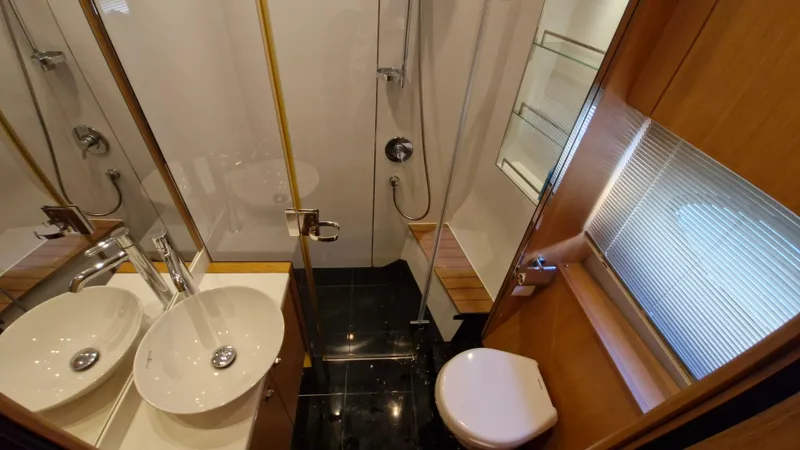  Yacht Photos Pics Luxurious bathroom in 2012 Princess V57 yacht with modern fixtures and elegant design.
