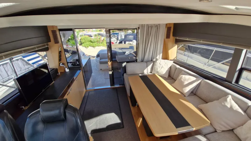  Yacht Photos Pics Luxurious interior of 2012 Princess V57 yacht with spacious seating and modern design.