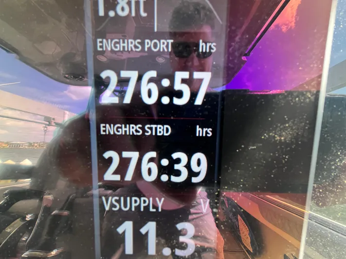  Yacht Photos Pics Display screen showing engine hours and voltage on a 2022 Seapro 320 DLX boat.