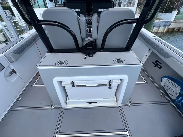  Yacht Photos Pics 2022 Seapro 320 DLX boat interior with seating and storage compartments.