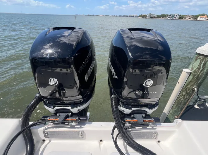  Yacht Photos Pics Twin Mercury outboard engines on a 2022 Seapro 320 DLX boat, ocean backdrop.