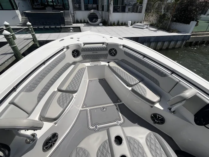  Yacht Photos Pics 2022 Seapro 320 DLX boat interior with cushioned seating and modern design.