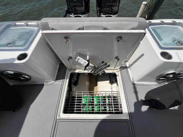  Yacht Photos Pics 2022 Seapro 320 DLX boat with open storage compartment and visible equipment.