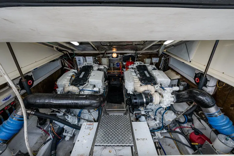 Sore Subject Yacht Photos Pics Engine room of 2007 Albemarle 36 Express boat, showcasing dual engines and mechanical components.